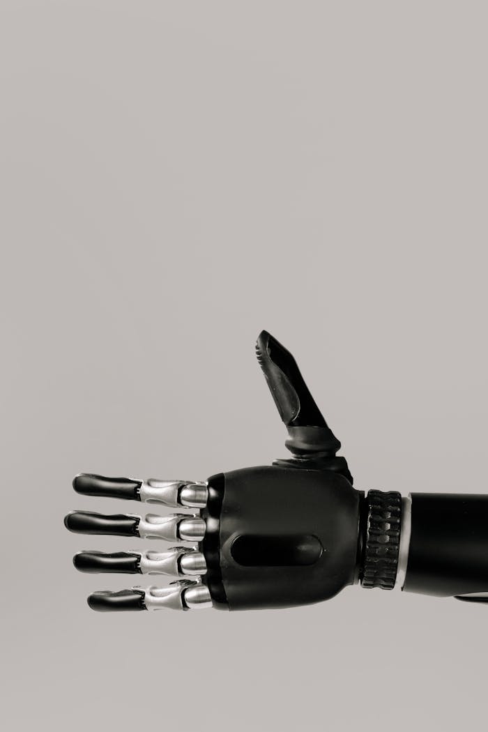 A detailed image of a futuristic robotic prosthetic hand with a neutral background.